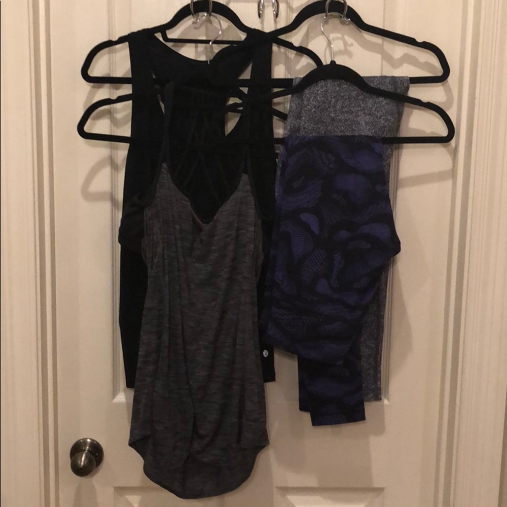 Two pairs of lululemon leggings and two shirts.